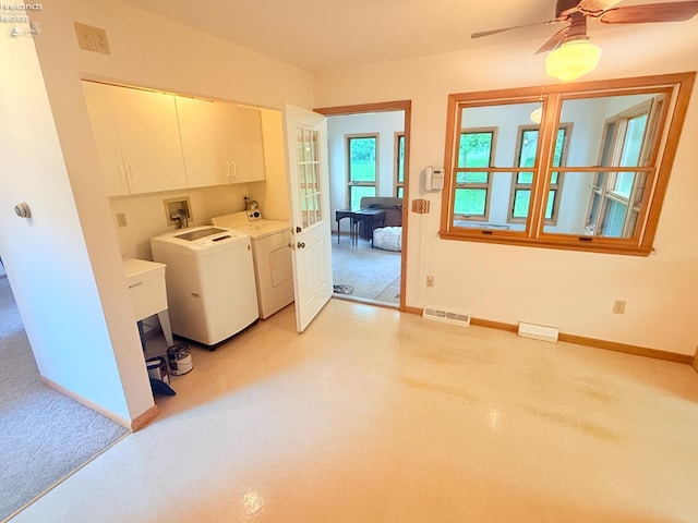 9343 E Bayshore Rd, Marblehead, OH 43440 - washroom featuring cabinet space, washing machine and dryer, baseboards, and a ceiling fan