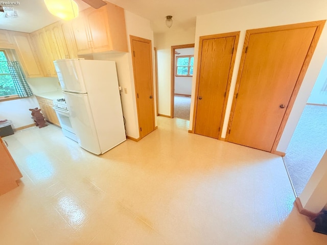 9343 E Bayshore Rd, Marblehead, OH 43440 - kitchen with white appliances, baseboards, light flooring, and light countertops