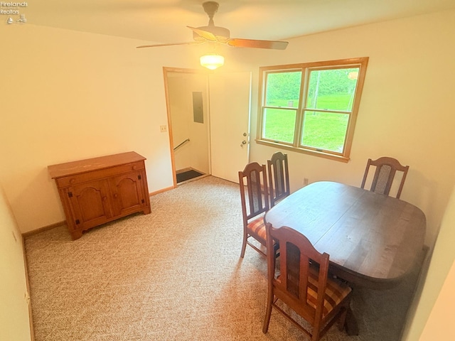 9343 E Bayshore Rd, Marblehead, OH 43440 - dining space featuring light colored carpet and ceiling fan