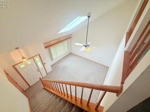 9343 E Bayshore Rd, Marblehead, OH 43440 - stairs featuring carpet, a skylight, and lofted ceiling