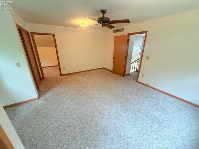 9343 E Bayshore Rd, Marblehead, OH 43440 - spare room featuring ceiling fan, light colored carpet, and baseboards