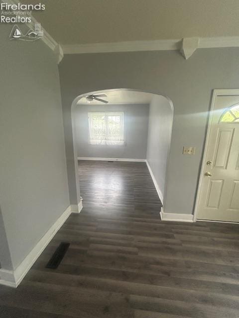 201 Heter St, Bellevue, OH 44811 - corridor featuring arched walkways, crown molding, baseboards, and wood finished floors