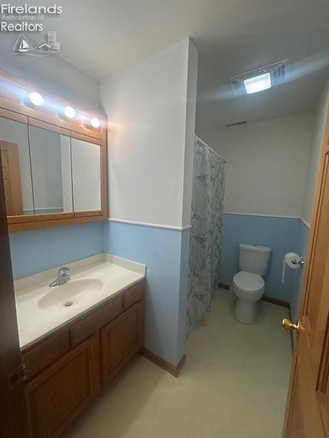 201 Heter St, Bellevue, OH 44811 - bathroom with vanity, toilet, baseboards, and a shower with curtain