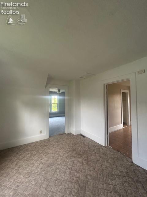 201 Heter St, Bellevue, OH 44811 - carpeted empty room featuring baseboards