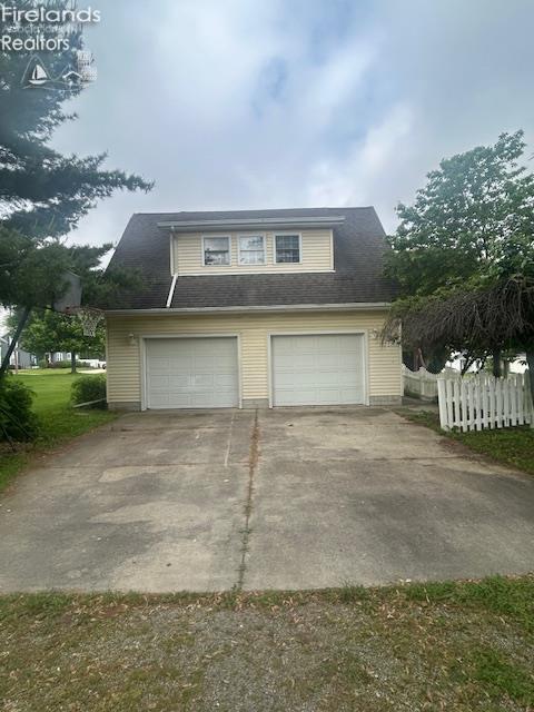 201 Heter St, Bellevue, OH 44811 - view of front of house featuring a garage and driveway