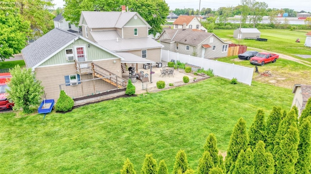 134 Hobson St, Bellevue, OH 44811 - back of property featuring board and batten siding, a patio area, stairs, a wooden deck, and a chimney