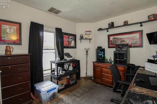 134 Hobson St, Bellevue, OH 44811 - office featuring dark wood-type flooring and a textured ceiling