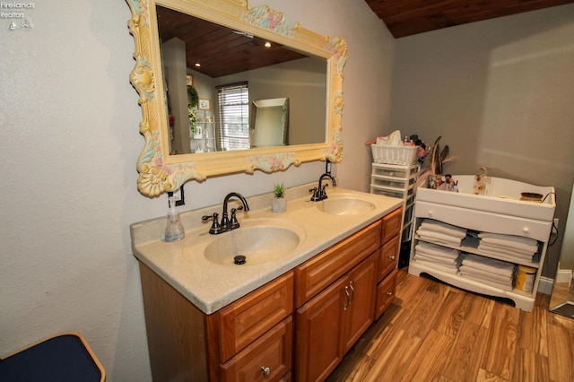 134 Hobson St, Bellevue, OH 44811 - full bath featuring wooden ceiling, double vanity, wood finished floors, and a tub to relax in