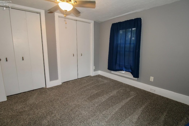 134 Hobson St, Bellevue, OH 44811 - unfurnished bedroom with carpet, two closets, baseboards, and ceiling fan