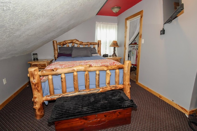 134 Hobson St, Bellevue, OH 44811 - carpeted bedroom featuring a textured ceiling, vaulted ceiling, and baseboards