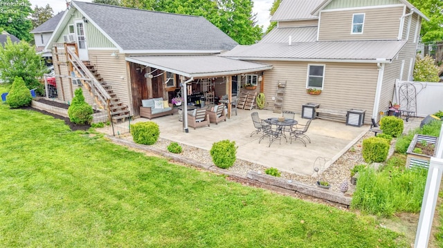 134 Hobson St, Bellevue, OH 44811 - back of house with stairway, a lawn, a patio area, and an outdoor living space