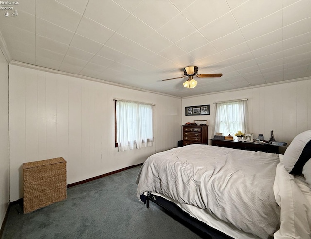 31 Mohawk St, Tiffin, OH 44883 - bedroom with carpet, a ceiling fan, ornamental molding, wooden walls, and baseboards
