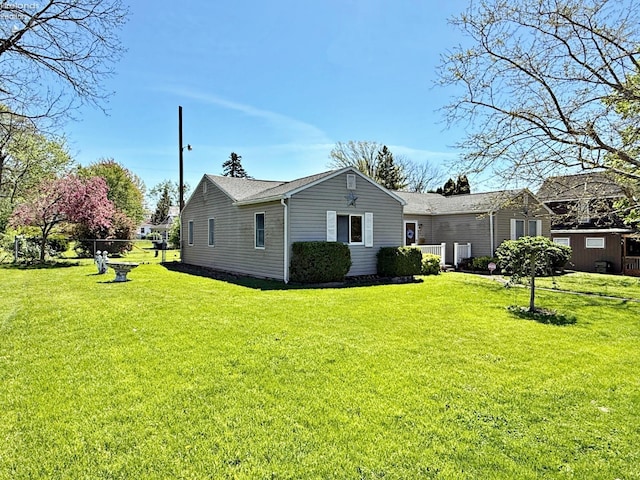 31 Mohawk St, Tiffin, OH 44883 - view of side of home featuring a lawn