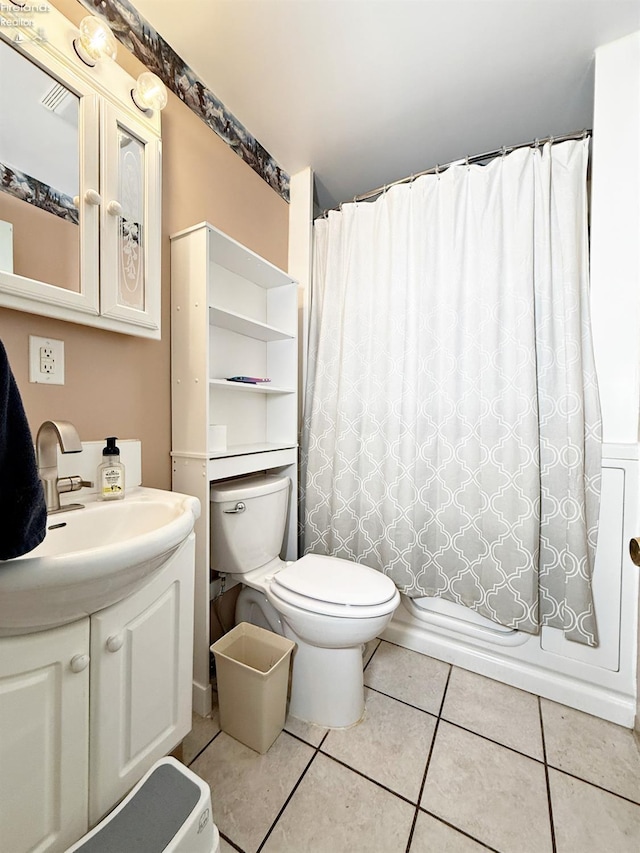 31 Mohawk St, Tiffin, OH 44883 - bathroom featuring toilet, vanity, and tile patterned flooring
