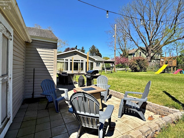31 Mohawk St, Tiffin, OH 44883 - view of patio / terrace with a fire pit, area for grilling, and a playground