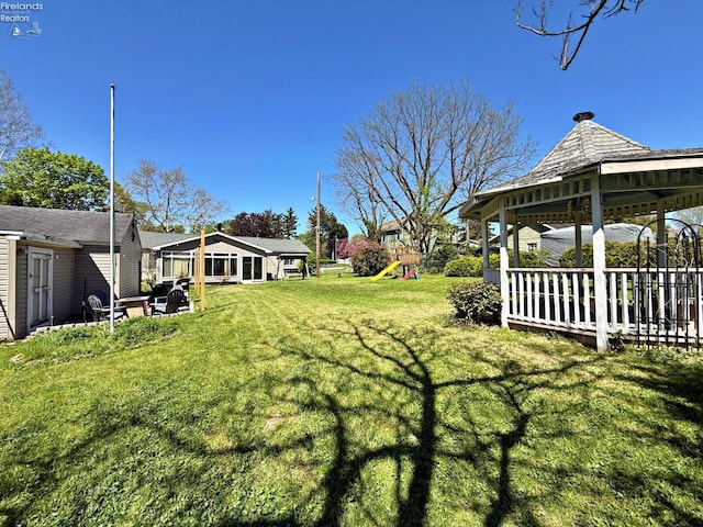 31 Mohawk St, Tiffin, OH 44883 - view of grassy yard featuring a playground and a gazebo