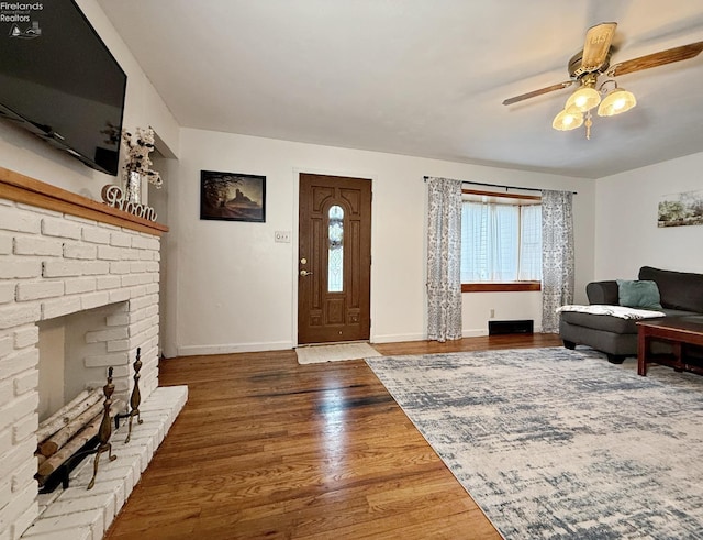31 Mohawk St, Tiffin, OH 44883 - living room featuring plenty of natural light, ceiling fan, wood finished floors, and baseboards