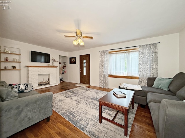 31 Mohawk St, Tiffin, OH 44883 - living area with ceiling fan, wood finished floors, a fireplace, and baseboards