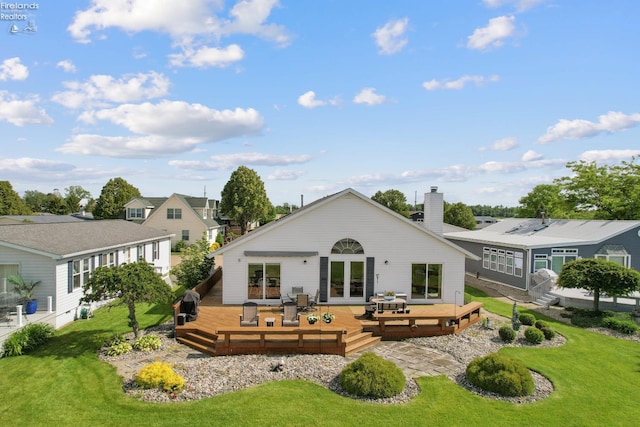 6485 E Harbor Rd Unit 38, Marblehead, OH 43440 - rear view of property featuring a wooden deck, french doors, a chimney, and a lawn