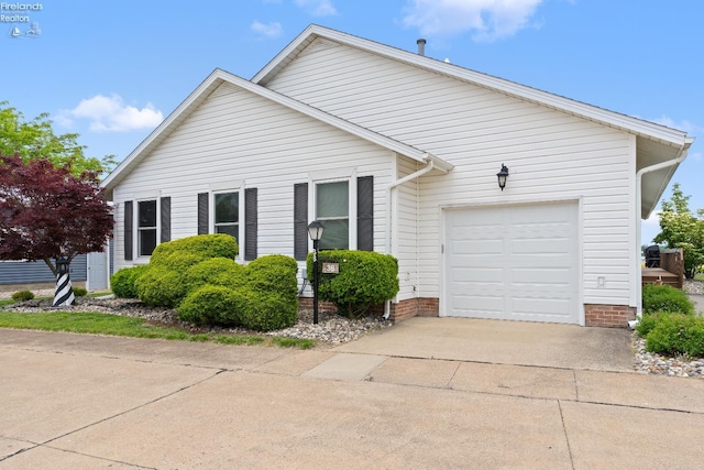6485 E Harbor Rd Unit 38, Marblehead, OH 43440 - view of front facade with concrete driveway and a garage