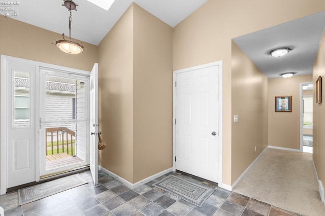 6485 E Harbor Rd Unit 38, Marblehead, OH 43440 - entryway with baseboards and dark stone finish floors