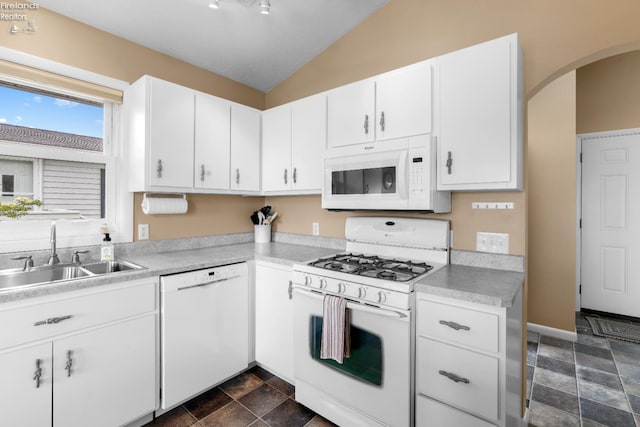 6485 E Harbor Rd Unit 38, Marblehead, OH 43440 - kitchen featuring white appliances, a sink, lofted ceiling, arched walkways, and light countertops