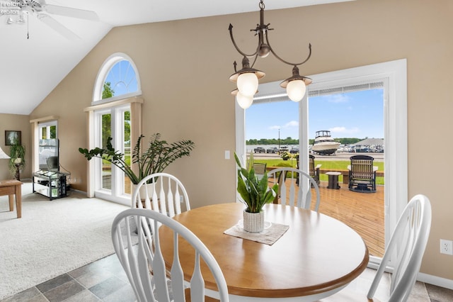 6485 E Harbor Rd Unit 38, Marblehead, OH 43440 - dining area featuring a ceiling fan, baseboards, carpet, and high vaulted ceiling
