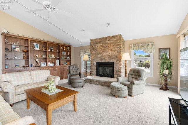 6485 E Harbor Rd Unit 38, Marblehead, OH 43440 - carpeted living area featuring lofted ceiling, a fireplace, ceiling fan, and baseboards