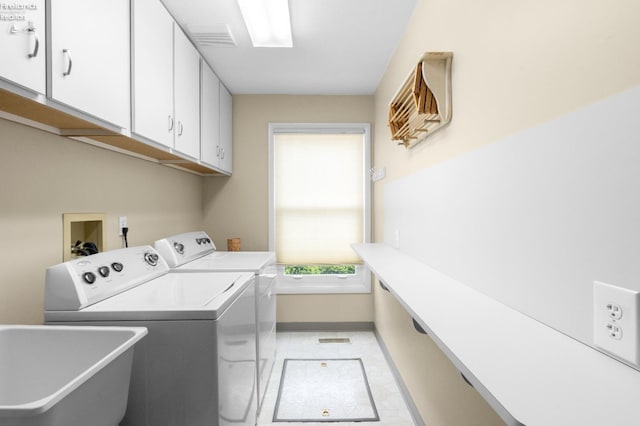 6485 E Harbor Rd Unit 38, Marblehead, OH 43440 - laundry room featuring cabinet space, washing machine and clothes dryer, and baseboards