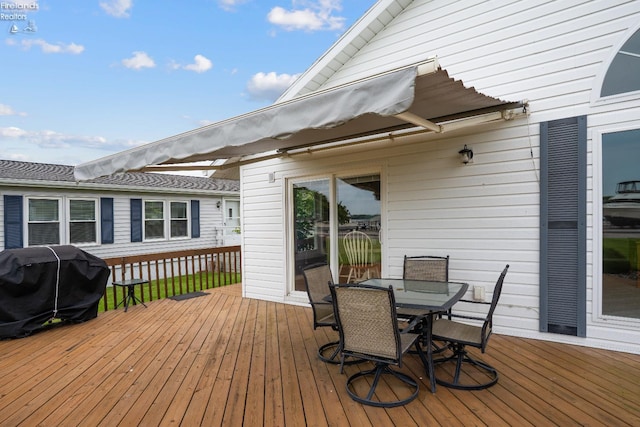 6485 E Harbor Rd Unit 38, Marblehead, OH 43440 - wooden terrace with grilling area and outdoor dining space