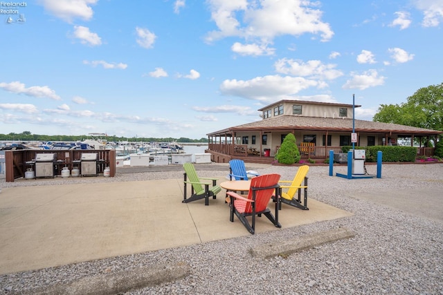 6485 E Harbor Rd Unit 38, Marblehead, OH 43440 - view of property's community with a patio area and a water view
