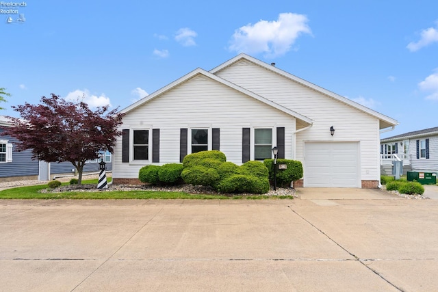 6485 E Harbor Rd Unit 38, Marblehead, OH 43440 - view of front of house featuring concrete driveway and a garage
