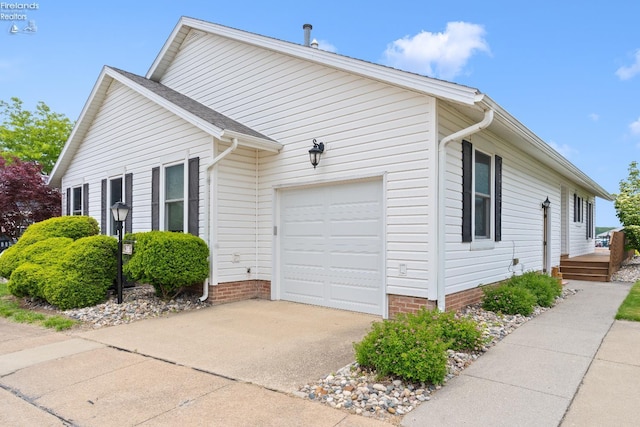 6485 E Harbor Rd Unit 38, Marblehead, OH 43440 - view of property exterior with a garage and driveway