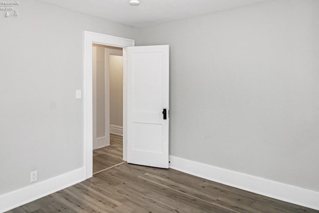 713 Madison St, Port Clinton, OH 43452 - unfurnished room with wood finished floors and baseboards