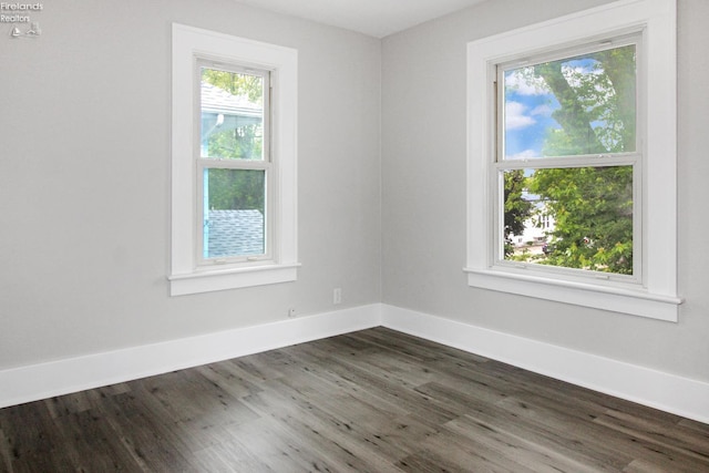 713 Madison St, Port Clinton, OH 43452 - unfurnished room with dark wood-type flooring and baseboards