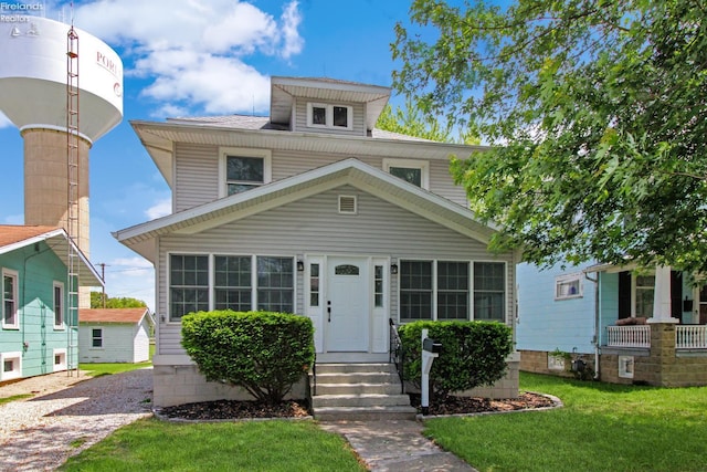 713 Madison St, Port Clinton, OH 43452 - american foursquare style home with a front yard