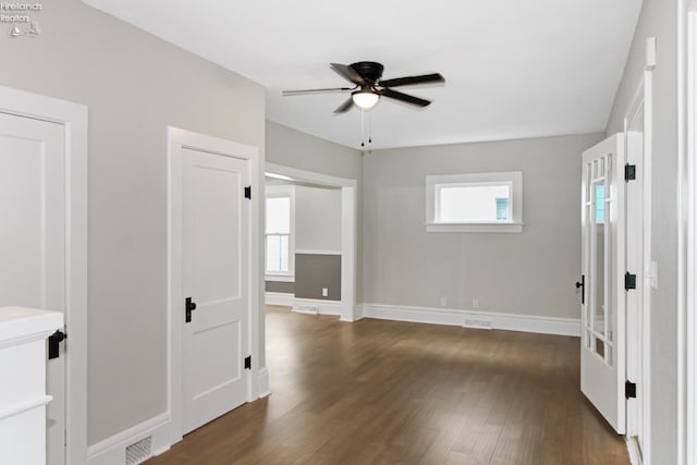 713 Madison St, Port Clinton, OH 43452 - unfurnished room with a ceiling fan, dark wood finished floors, and baseboards
