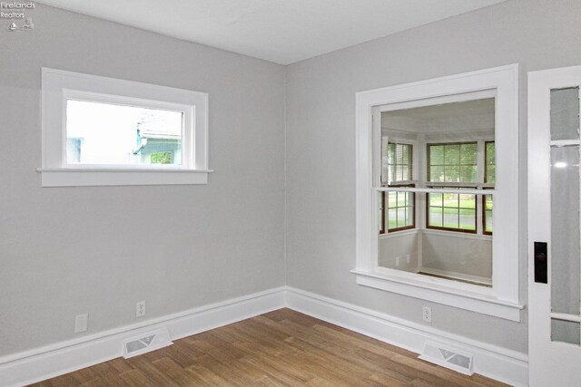 713 Madison St, Port Clinton, OH 43452 - spare room with wood finished floors and baseboards