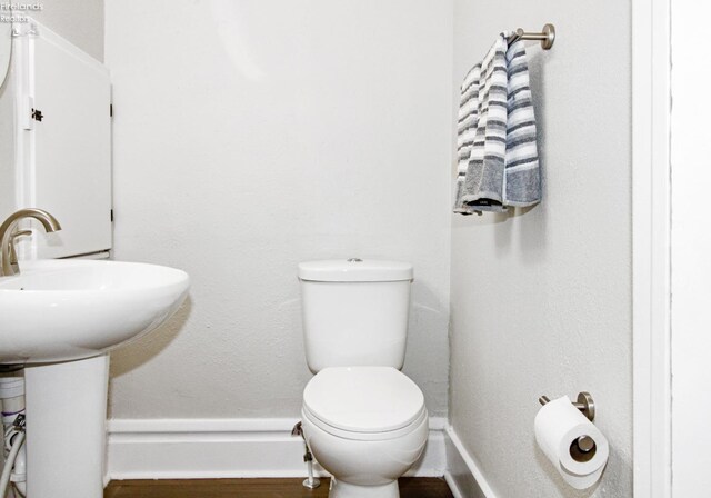 713 Madison St, Port Clinton, OH 43452 - bathroom featuring toilet and baseboards