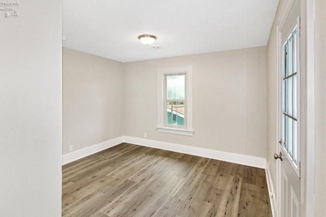 713 Madison St, Port Clinton, OH 43452 - empty room featuring wood finished floors and baseboards