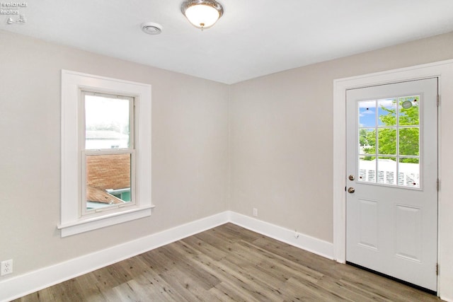 713 Madison St, Port Clinton, OH 43452 - doorway featuring light wood-style flooring and baseboards