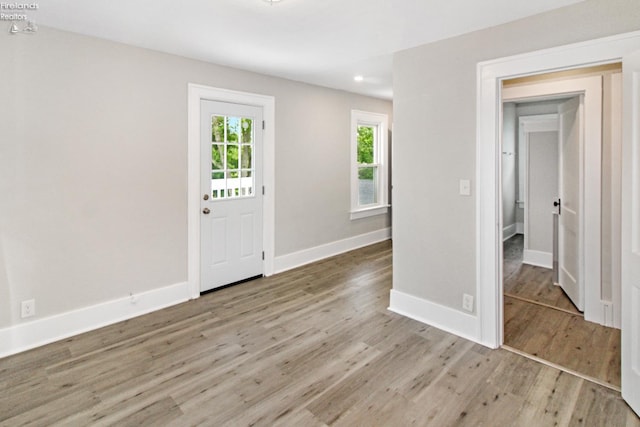 713 Madison St, Port Clinton, OH 43452 - entryway featuring wood finished floors, baseboards, and recessed lighting