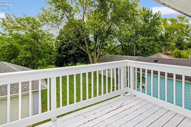 713 Madison St, Port Clinton, OH 43452 - wooden terrace with a lawn and view of wooded area