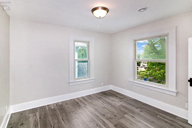713 Madison St, Port Clinton, OH 43452 - unfurnished room with wood finished floors and baseboards