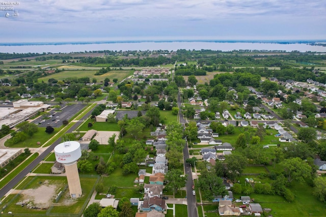 713 Madison St, Port Clinton, OH 43452 - aerial view of property's location with nearby suburban area, a large body of water, and a tree filled landscape