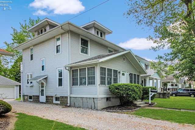 713 Madison St, Port Clinton, OH 43452 - view of property exterior with an outbuilding, a yard, and a detached garage