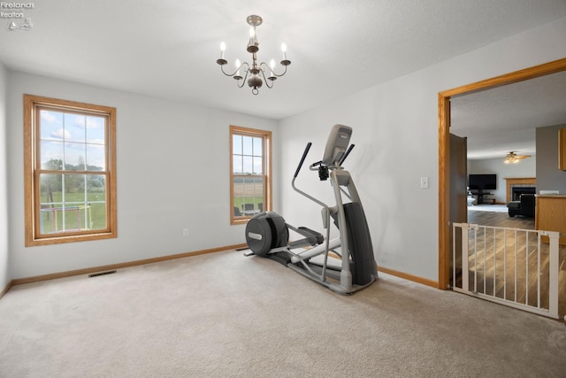 4936 Gibbs Rd, Norwalk, OH 44857 - exercise room featuring baseboards, a chandelier, and carpet flooring