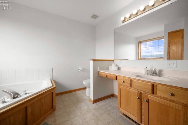 4936 Gibbs Rd, Norwalk, OH 44857 - full bath with baseboards, a bath, vanity, and toilet