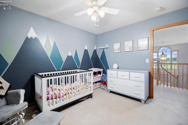 4936 Gibbs Rd, Norwalk, OH 44857 - bedroom with light carpet, a nursery area, and ceiling fan