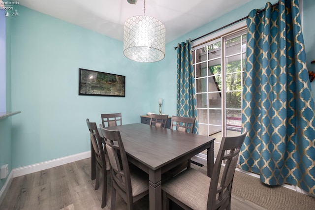 4370 Marin Woods Dr Unit D, Port Clinton, OH 43452 - dining room with wood finished floors and baseboards